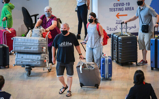 Travelers at Ben Gurion International Airport, on June 30, 2021, heading for COVID-19 tests. (Avshalom Sassoni/Flash90)