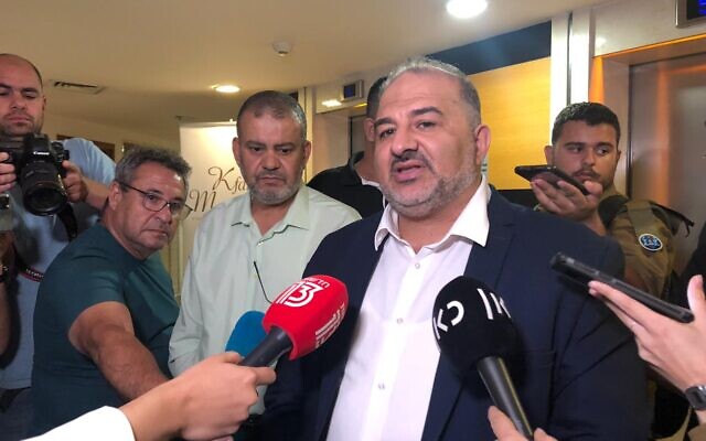 Ra'am party chief Mansour Abbas speaks with reporters following coalition talks in Kfar Maccabiah, Ramat Gan on Wednesday, June 2, 2021 (Tal Schneider/The Times of Israel)