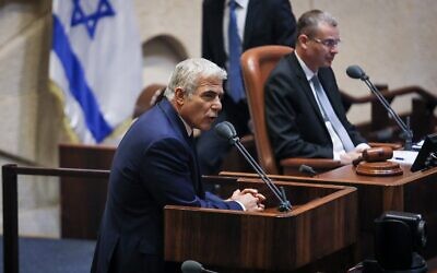 Yair Lapid addresses the Knesset, June 13, 2021. (Noam Moskowitz/Knesset spokesperson)