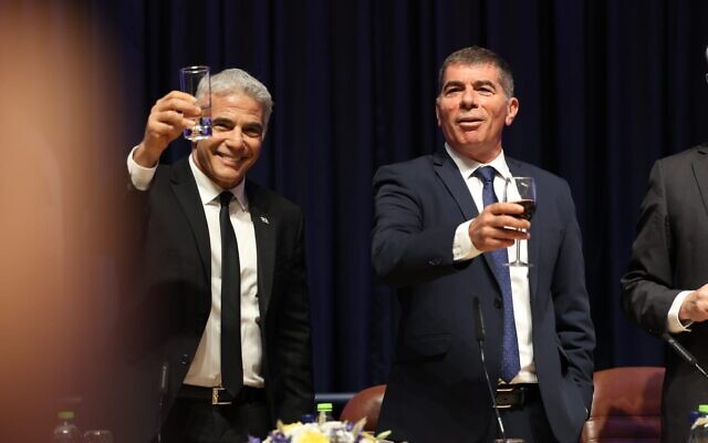 Newly appointed Foreign Minister Yair Lapid (L) with outgoing minister Gabi Ashkenazi, at handover ceremony held at the Foreign Ministry in Jerusalem on June 14, 2021. (Foreign Ministry)