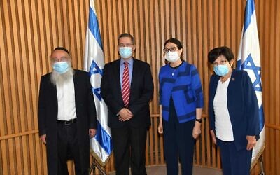 The newly appointed members of the Meron disaster commission: Commission chair and former chief justice Miriam Naor, right, former Bnei Brak mayor Rabbi Mordechai Karelitz, left, former IDF planning chief Maj. Gen. (res.) Shlomo Yanai, 2nd left, and sitting Supreme Court Chief Justice Esther Hayut, 2nd right, who chose the commission members, on June 27, 2021. (Courtesy Courts Authority)
