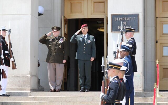 IDF Chief of Staff Aviv Kohavi, center-right, and US Chairman of the Joint Chiefs of Staff Mark Milley, center-left, salute outside the US Department of Defense in Washington, DC, on June 21, 2021. (Israel Defense Forces)