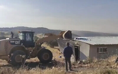 A structure is demolished at the Oz Zion illegal outpost north of Jerusalem, June 23, 2021 (video screenshot)
