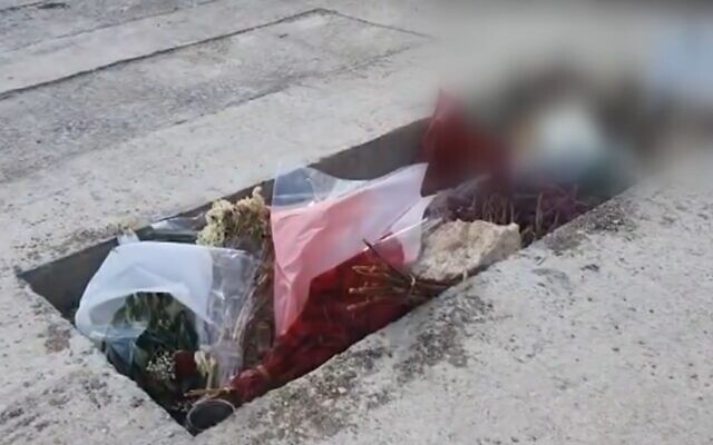 The grave of an IDF officer who died in jail under unclear circumstances. (Screen grab/Kan)