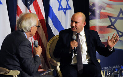 Illustrative: Then-Jewish Home party chairman Naftali Bennett (R) is interviewed by Brookings Executive Vice President Martin Indyk at the Brookings Institute in Washington on December 6, 2014. (Brookings Institute)