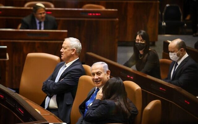 Defense Minister Benny Gantz and then-outgoing prime minister Benjamin Netanyahu, in the Knesset plenum, June 13, 2021. (Noam Moskowitz/ Knesset)