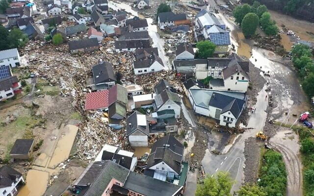 Aerial view taken on July 15, 2021, shows the flooded village of Schuld, near Adenau, western Germany, after heavy rains and floods caused damage and tore down at least six houses, and dozens of people went missing. (Christoph Reichwein / dpa / AFP)