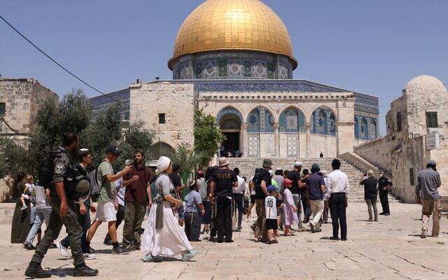 Israeli security forces stand guard as a group of Jews enter the Temple Mount in Jerusalem's Old City, during the Tisha B'Av fast mourning the destruction of the ancient temples, on July 18, 2021. (Ahmad Gharabli/AFP)