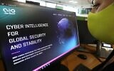 A woman checks the website of Israel-made Pegasus spyware at an office in the Cypriot capital Nicosia on July 21, 2021. (Mario Goldman/AFP)