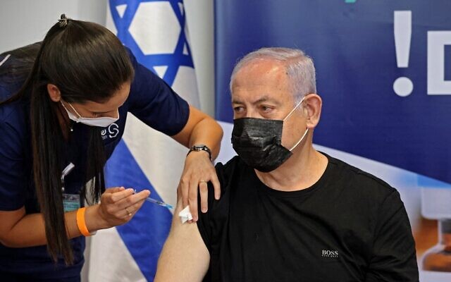 Opposition Leader Benjamin Netanyahu receives a third dose of the Pfizer-BioNTech coronavirus vaccine at Sheba Medical Center on July 30, 2021. (Emmanuel Dunand/AFP)