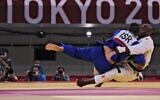 France's Teddy Riner (white) and Israel's Or Sasson compete in the judo mixed team's quarterfinal bout during the Tokyo 2020 Olympic Games at the Nippon Budokan in Tokyo on July 31, 2021. (Jack GUEZ / AFP)