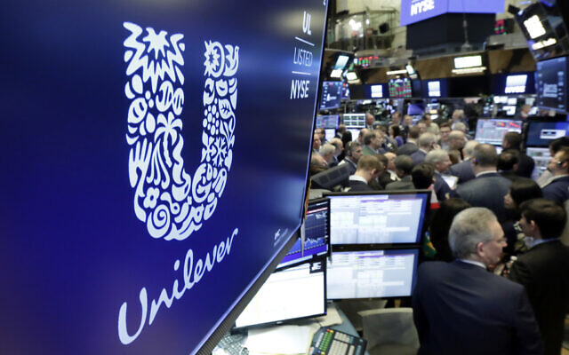 In this March 15, 2018, photo, the logo for Unilever appears above a trading post on the floor of the New York Stock Exchange. (AP Photo/Richard Drew, file)