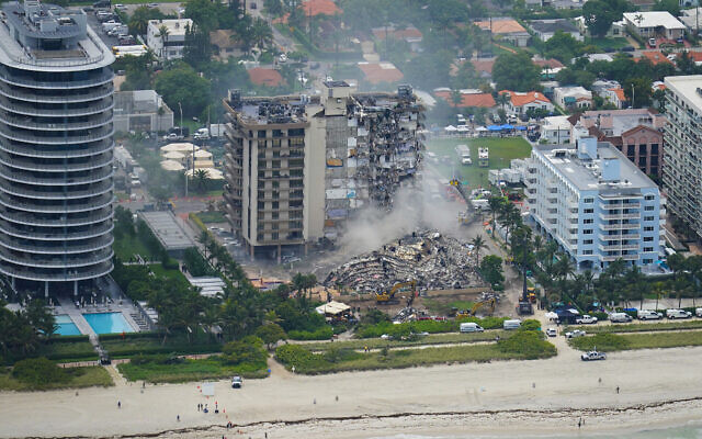 Illustrative: Rescue personnel work in the rubble at the Champlain Towers South Condo, in Surfside, Florida, June 25, 2021. (Gerald Herbert/AP)