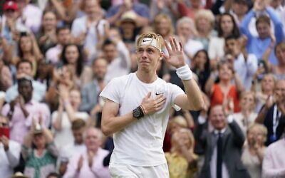 Canada's Denis Shapovalov acknowledges the crowd after being defeated by Serbia's Novak Djokovic during the men's singles semifinals match on day eleven of the Wimbledon Tennis Championships in London, July 9, 2021. (AP Photo/Alberto Pezzali)