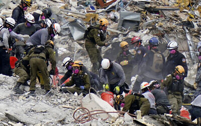 Crews from the United States and Israel work in the rubble Champlain Towers South condo, June 29, 2021, in Surfside, Florida. (AP/Lynne Sladky)