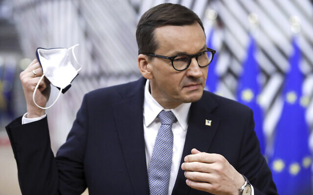 Poland's Prime Minister Mateusz Morawiecki speaks with the media as he arrives for an EU summit at the European Council building in Brussels, on May 24, 2021. (Olivier Hoslet, Pool via AP, File)