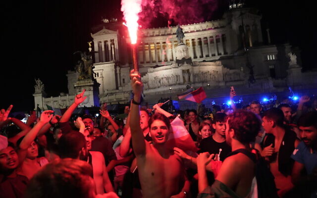 Italy's fans celebrate in Rome, on July 12, 2021, after Italy beat England to win the Euro 2020 soccer championships. (AP Photo/Alessandra Tarantino)