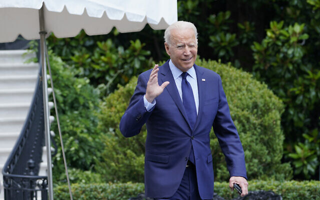 US President Joe Biden tries to hear questions shouted by reporters as he heads to Marine One on the South Lawn of the White House in Washington, July 16, 2021, to spend the weekend at Camp David. (AP Photo/Susan Walsh)