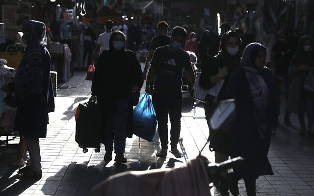 People walk around in a commercial district in downtown Tehran, Iran, July, 17, 2021. (AP Photo/Vahid Salemi)
