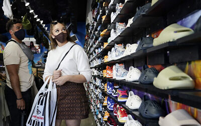 In this July 19, 2021, file photo, shoppers wear masks inside of The Cool store in the Fairfax district of Los Angeles. (AP Photo/Marcio Jose Sanchez)