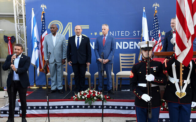 (L-R) US House Foreign Affairs Committee chairman Gregory Meeks, Prime Minister Naftali Bennett and US Embassy in Israel Charge D'affaires Michael Ratney at the US Embassy's Independence Day celebration on July 5, 2021. (Ziv Sokolov/US Embassy in Jerusalem)