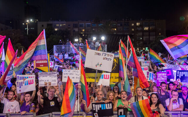 Thousands of Israelis attend a protest against a Knesset bill amendment denying surrogacy for same-sex couples, at Rabin Square in Tel Aviv on July 22, 2018 (Miriam Alster/Flash90)