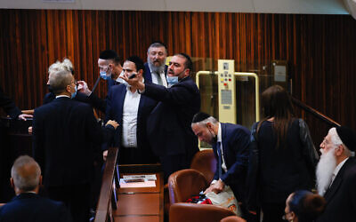 Members of the opposition argue during a discussion on a law regarding unemployment payouts during a plenum session in the Knesset in Jerusalem on July 1, 2021. (Yonatan Sindel/FLASH90)