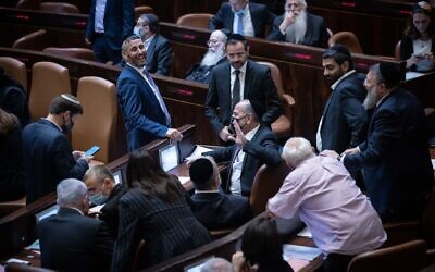 Opposition members rejoice after a Knesset vote rejected an extension of the Palestinian family reunification law, in Jerusalem, on July 6, 2021. (Yonatan Sindel/Flash90)