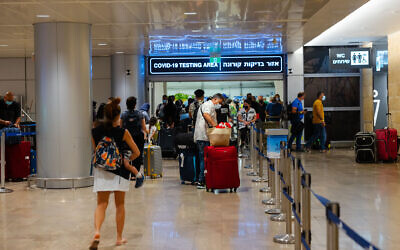 Travelers at Ben Gurion International Airport, on June 30, 2021, heading for COVID-19 tests. (Nati Shohat/Flash90)