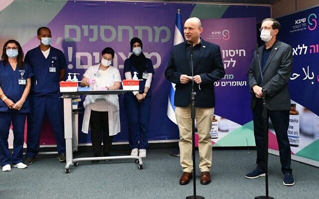 Prime Minister Naftali Bennett speaks at Sheba Medical Center at Tel Hashomer, starting the campaign for the third dose booster of the Coronavirus vaccine. (Haim Zach / GPO)