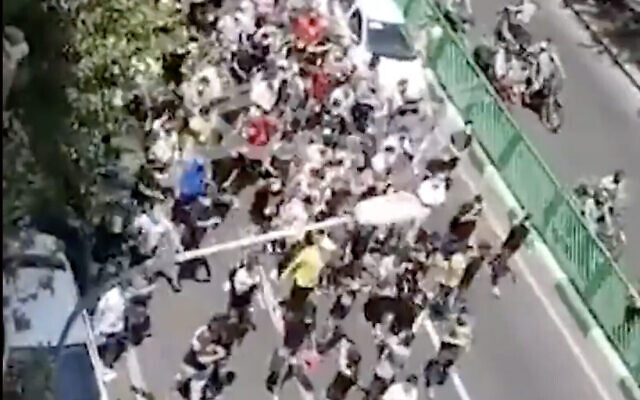 A screenshot from video of protesters marching in Tehran, Iran, on July 26, 2021. (Screen capture: Twitter)