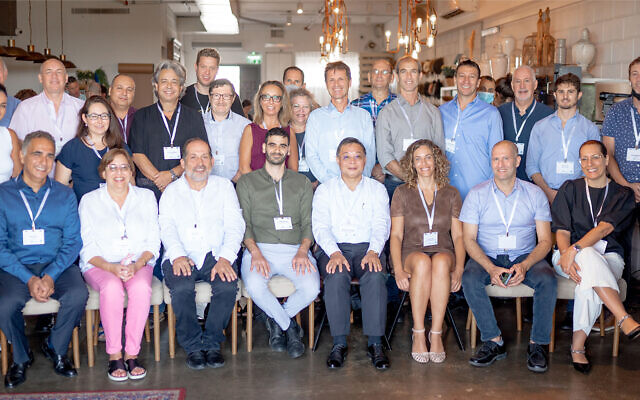 Representatives of Israeli companies selected for a Taiwanese incubator program, and representatives from the program, at an event in Tel Aviv, on July 27, 2021. (Courtesy/Nati Levi)