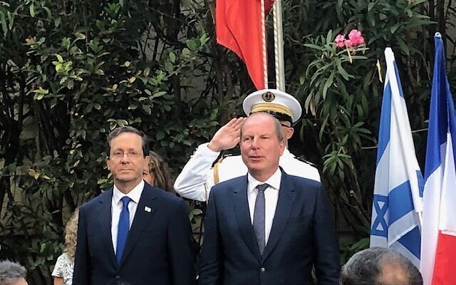 President Isaac Herzog (L) and French Ambassador Eric Danon at a Bastille Day celebration, Jaffa, July 14, 2021 (Lazar Berman/Times of Israel)