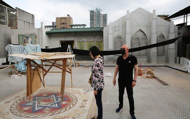 NaTang, left, and Jeffrey D. Schwartz inspect the rooftop plaza in Taiwan's new Jewish community center, currently under construction. (Glenn Leibowitz)