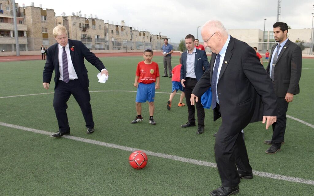 President Reuven Rivlin (R) playing soccer with then-London mayor Boris Johnson (L) in Jerusalem, November 11, 2015. (Mark Neyman/GPO)