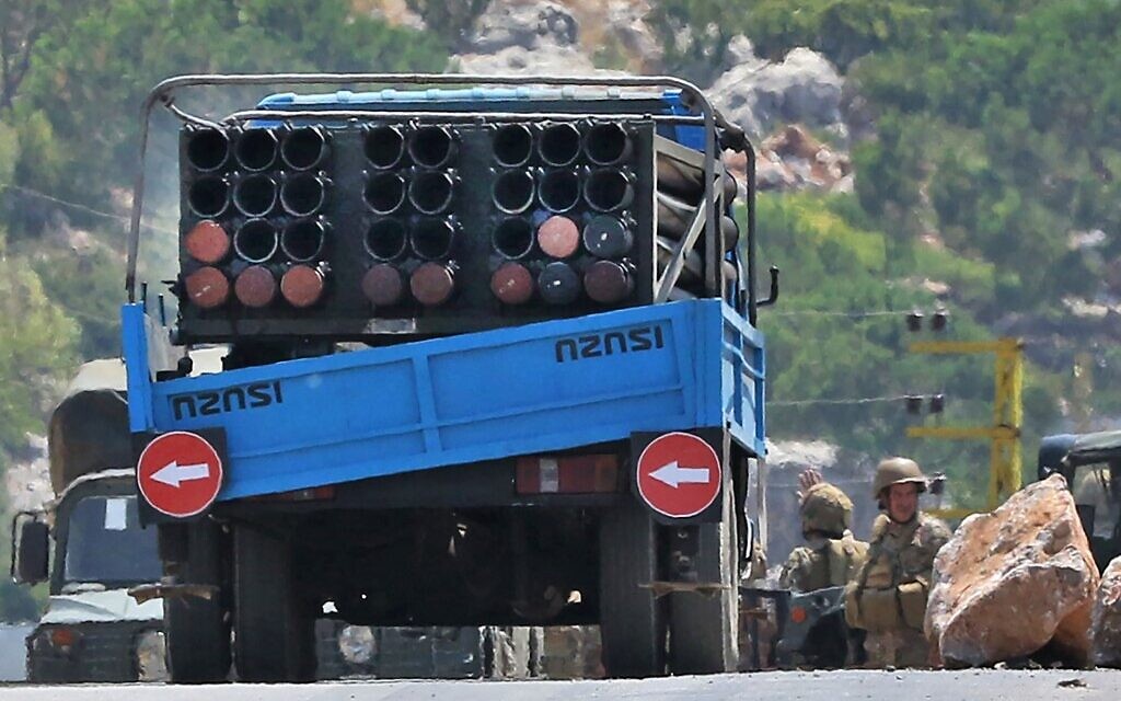 Lebanese soldiers stand next to a truck carrying a multiple rocket launcher after confiscating it, in the southern village of Shouayya, on August 6, 2021 (Mahmoud ZAYYAT / AFP)