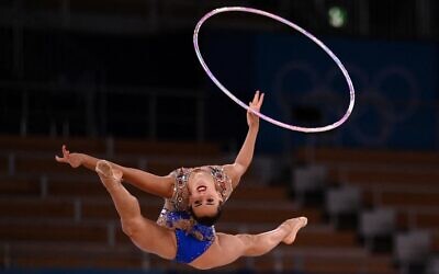 Israel's Linoy Ashram competes in the individual all-around final of the Rhythmic Gymnastics event during Tokyo 2020 Olympic Games at Ariake Gymnastics centre in Tokyo, on August 7, 2021. (Martin BUREAU / AFP)