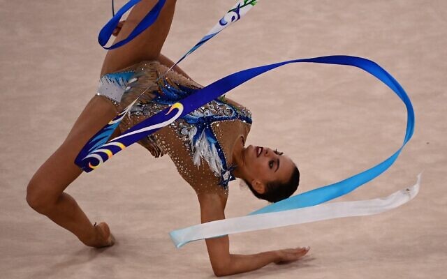 Israel's Linoy Ashram competes in the individual all-around final of the Rhythmic Gymnastics event during Tokyo 2020 Olympic Games at Ariake Gymnastics centre in Tokyo, on August 7, 2021. (Martin BUREAU / AFP)