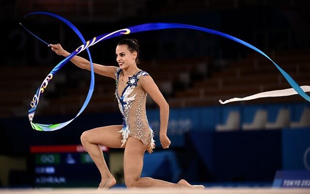 Israeli gold medalist Linoy Ashram competes in the individual all-around final of the Rhythmic Gymnastics event during Tokyo 2020 Olympic Games, on August 7, 2021. (Lionel Bonaventure/AFP)