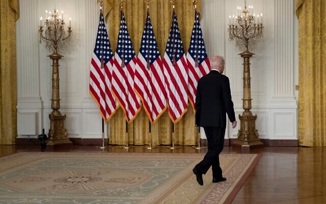 US President Joe Biden leaves after speaking about the Taliban's takeover of Afghanistan, from the East Room of the White House, on August 16, 2021, in Washington, DC. (Brendan Smialowski/AFP)
