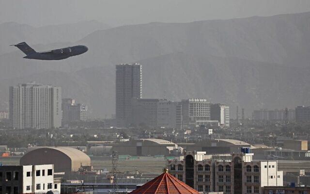 A US Air Force aircraft takes off from the military airport in Kabul on August 27, 2021, as the Pentagon said the evacuation of tens of thousands of people from Afghanistan still faces more possible attacks like the bombing that killed scores of people outside the Kabul airport. (AFP)