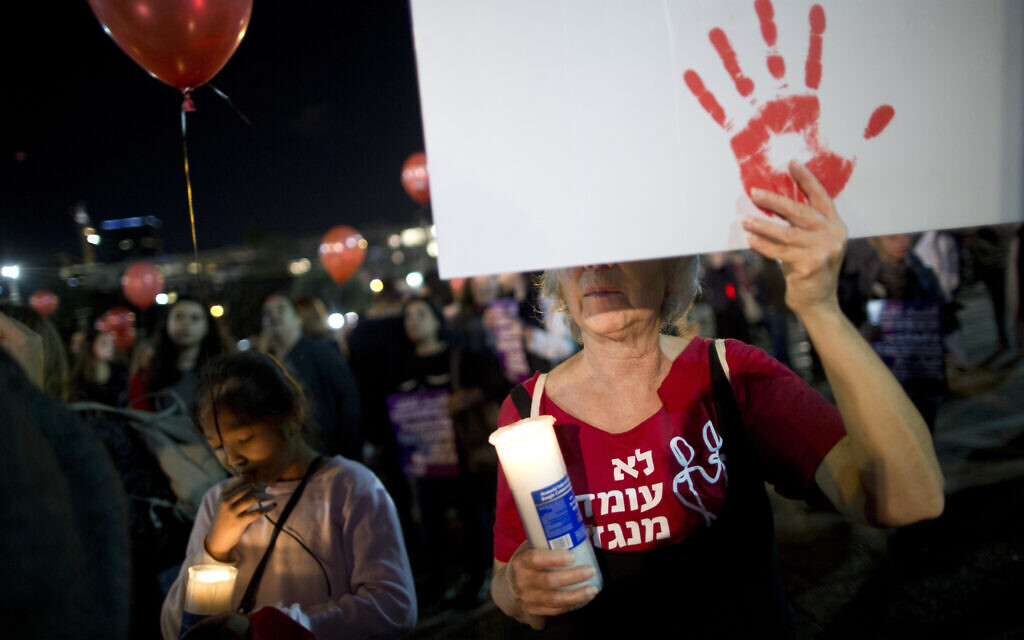 Illustrative: a protest against violence against women in Tel Aviv, December 4, 2018. (AP Photo/Oded Balilty)