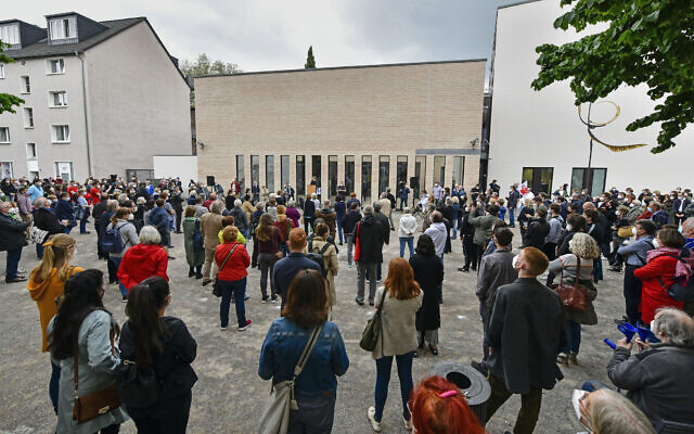 Hundreds of people keep a vigil at the synagogue in Gelsenkirchen, Germany, on Friday, May 14, 2021. (AP Photo/Martin Meissner)