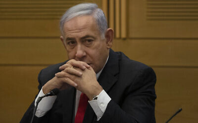 Benjamin Netanyahu speaks to right-wing opposition party members a day after a new government was sworn in, at the Knesset in Jerusalem, June 14, 2021. (AP Photo/Maya Alleruzzo)