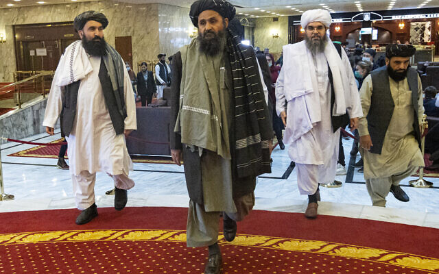 Taliban co-founder Mullah Abdul Ghani Baradar, center, arrives with other members of the Taliban delegation for an international peace conference in Moscow, Russia, on March 18, 2021. (AP/Alexander Zemlianichenko, Pool, File)