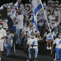 Athletes from Israel enter the stadium during the opening ceremony for the 2020 Paralympics at the National Stadium in Tokyo, Tuesday, Aug. 24, 2021. (AP Photo/Emilio Morenatti)