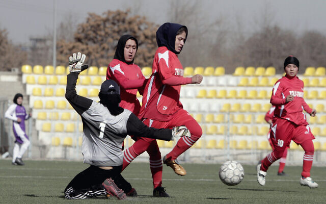 Illustrative: Afghan female soccer players compete in a match at the Afghanistan Football Federation (AFF) stadium in Kabul, on Friday, December 6, 2013. (AP Photo/Rahmat Gul)