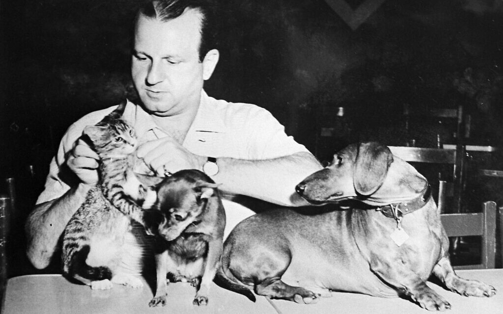 Dallas nightclub owner Jack Ruby, who killed Lee Harvey Oswald, is shown with his pets. This undated photo was on the wall of Ruby's office. (AP Photo)