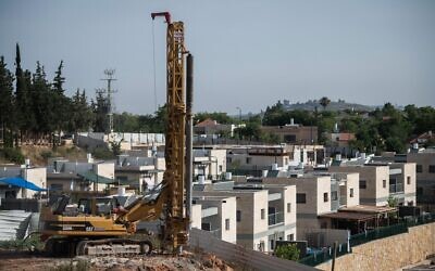Construction work is seen in the West Bank settlement of Yakir, on June 11, 2020. (Sraya Diamant/Flash90)