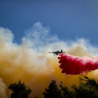 Firefighting planes try to extinguish a brush fire west of Jerusalem, August 15, 2021. (Yonatan Sindel/Flash90)